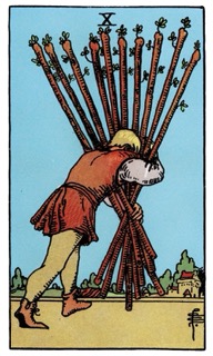 Rider–Waite Ten of Wands tarot card depicting a figure carrying a heavy bundle of wands, symbolizing burden, responsibility, and the weight of commitments.