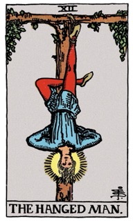 Rider-Waite Tarot card The Hanged Man, symbolizing pause, perspective shift, and letting go of control.