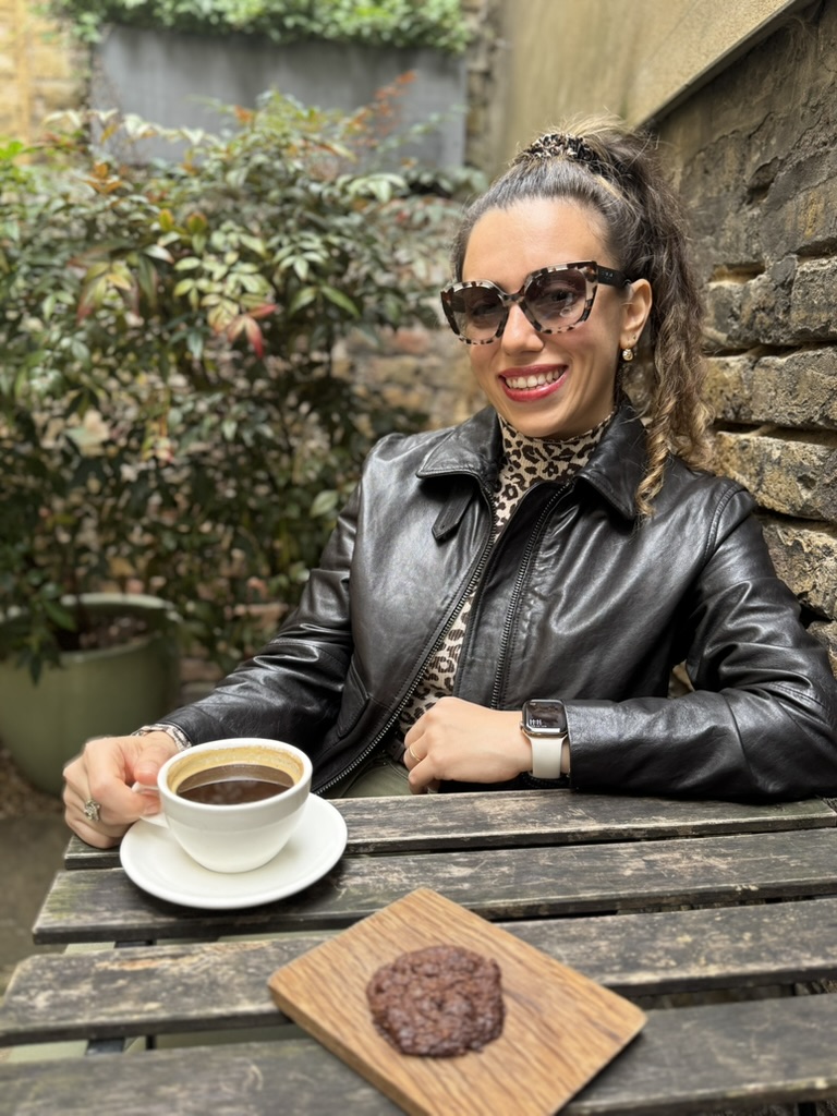 Simge enjoying a coffee at an outdoor café